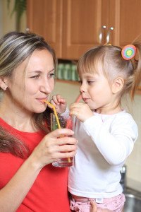 Woman and daughter Sipping healthy drinking water